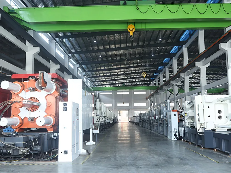 Industrial workshop with die casting equipment and overhead lifting access